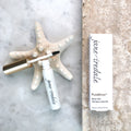 Jane Iredale Purebrow Gel klar bryngelé og emballage på marmor med søstjerne